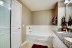 Master en suite with double sinks, separate tub and glass enclosed shower 